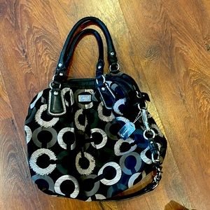 Black coach purse with silver tags